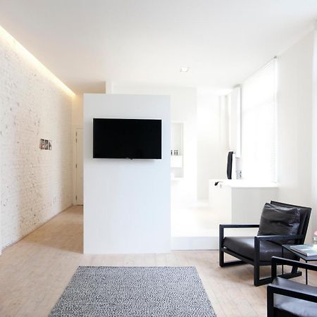 Maison Nationale City Flats & Suites Antwerpen Kamer foto A room at the hotel